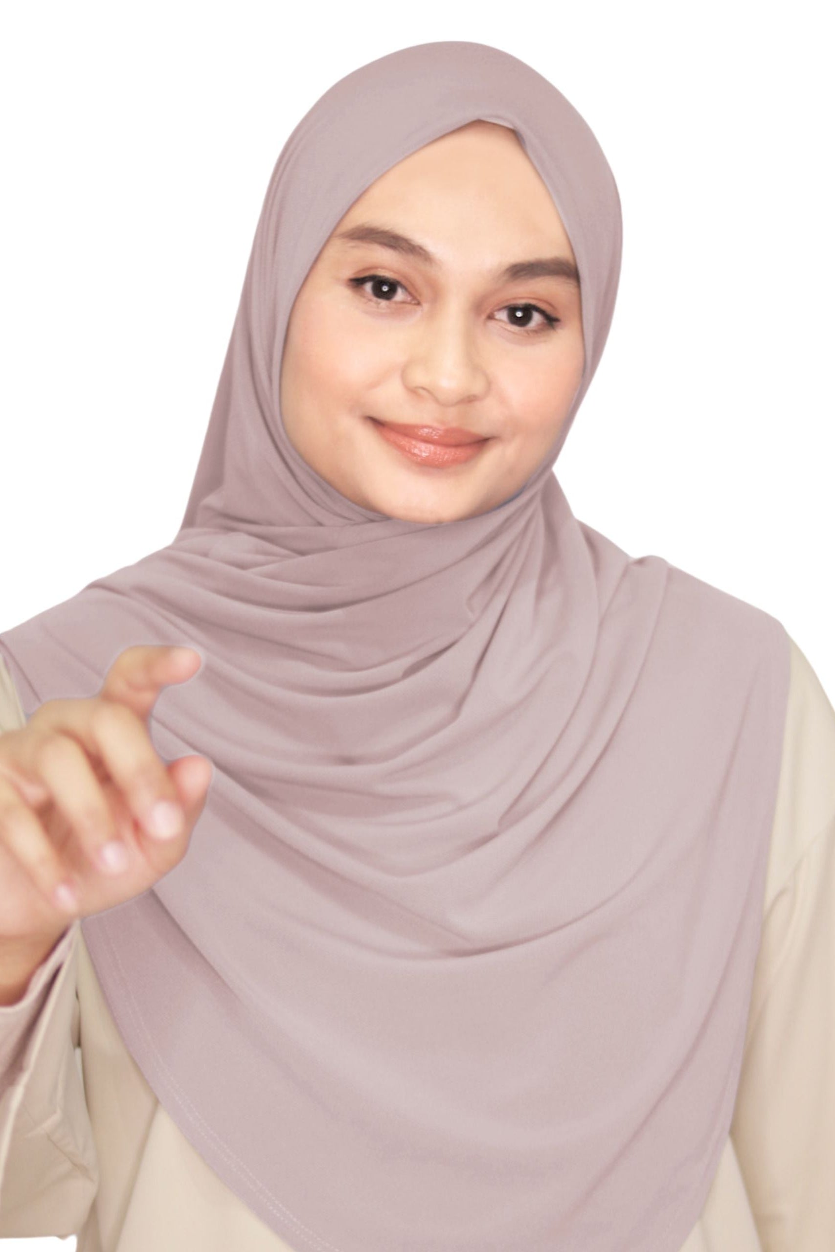 Woman wearing a light pink hijab on a white background