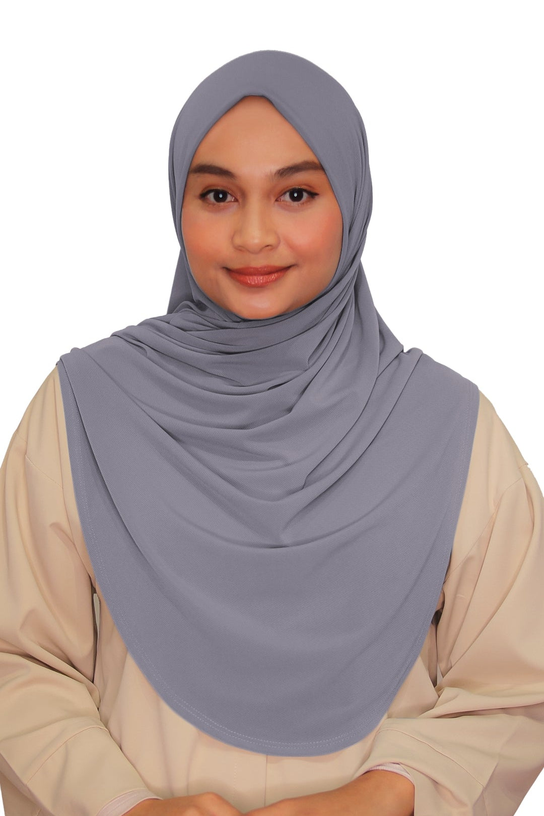 Woman wearing a light gray hijab and beige outfit on a white background