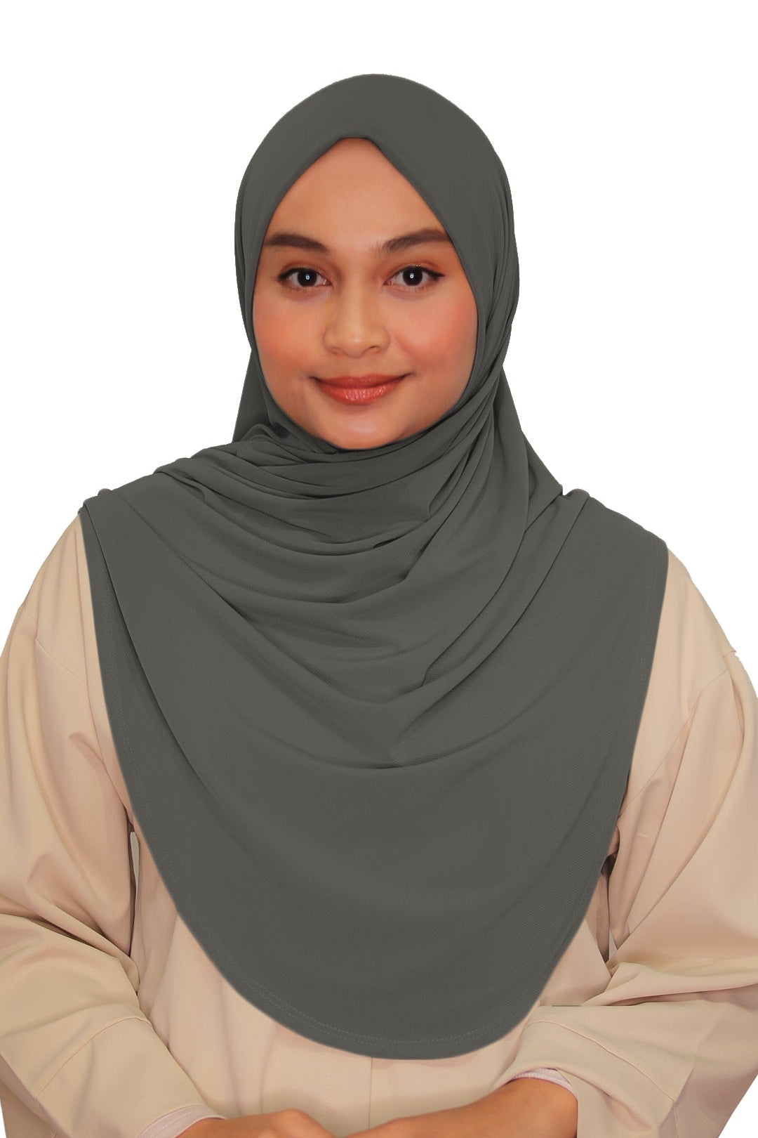 Woman wearing a gray hijab and beige outfit on a white background