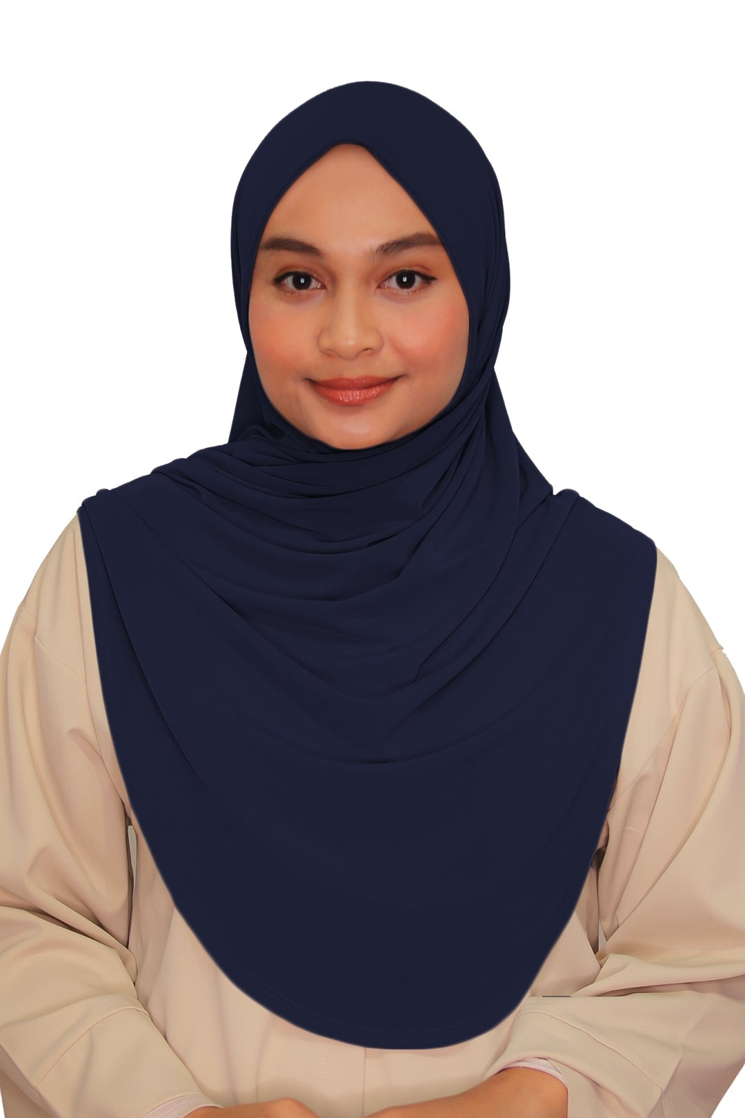 Woman wearing a navy hijab and beige outfit on a white background