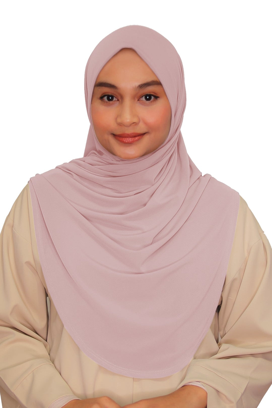 Woman wearing a light pink hijab and beige top on a white background