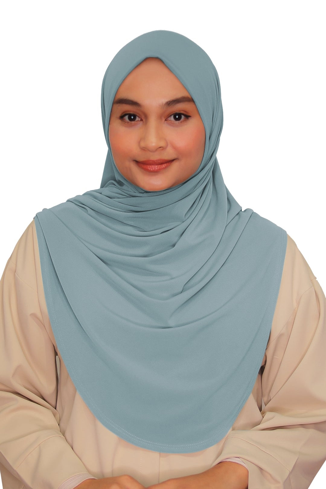 Woman wearing a light blue hijab and beige outfit on a white background