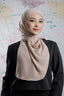 Woman wearing a beige hijab against a colorful abstract background